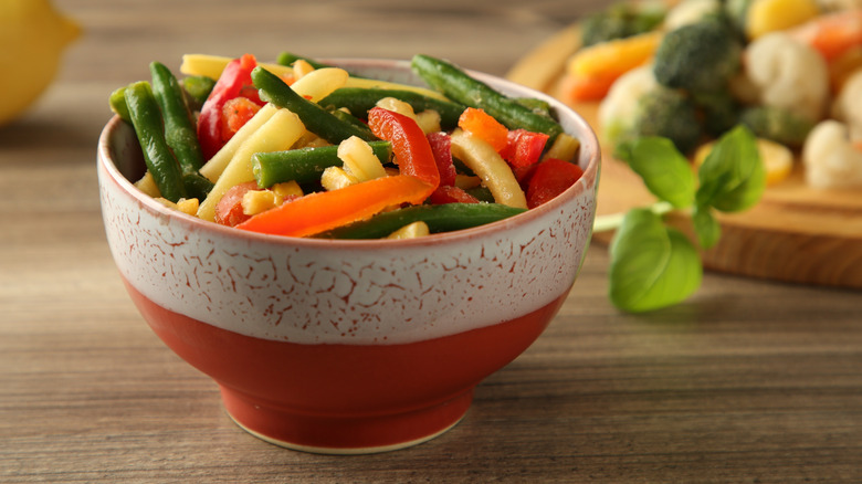Frozen vegetables thawing in bowl
