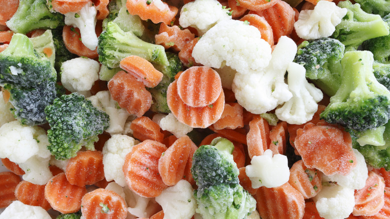 Close up of frozen cauliflower, broccoli, and carrots