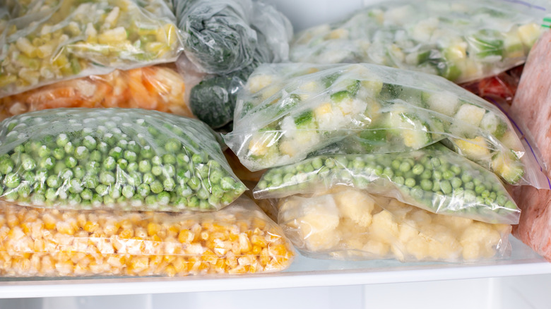 Bags of frozen vegetables in freezer