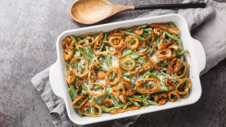 Green bean casserole in white casserole dish on counter