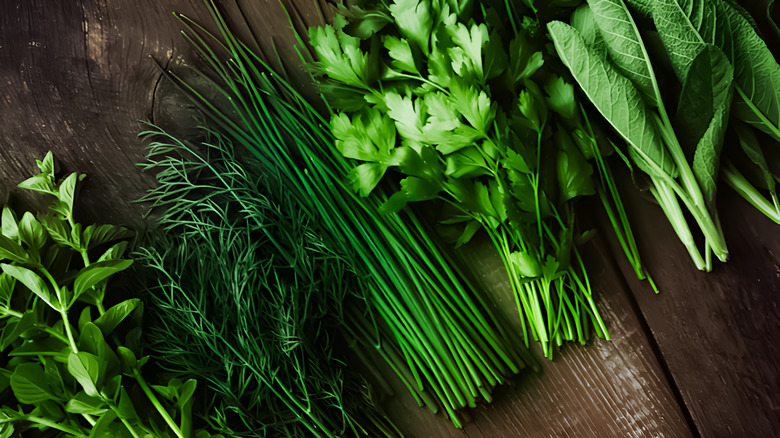 freshly clipped herbs on a wood background
