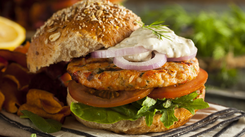 Salmon burger with salad and tartar sauce