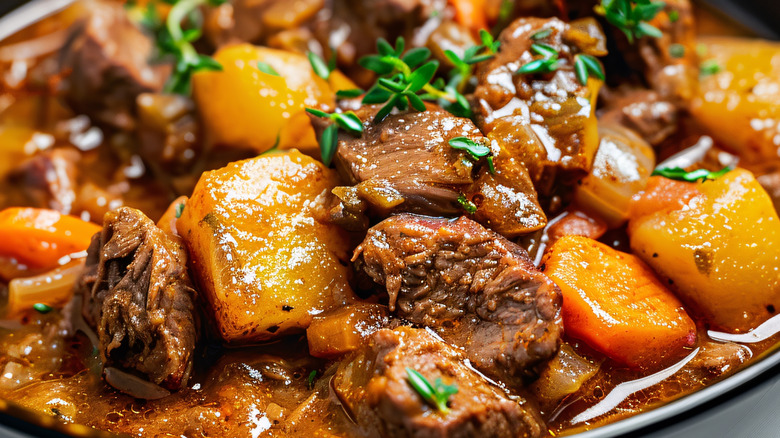Beef stew in black bowl