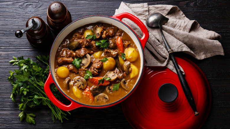 Beef stew in red Dutch oven