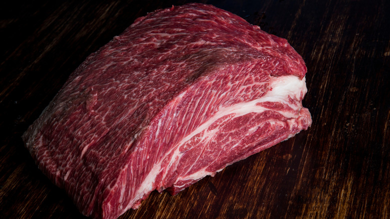 Large chuck roast on wooden cutting board