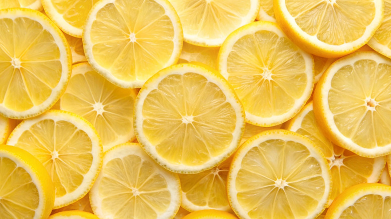 A close up of lemon slices arranged in pile
