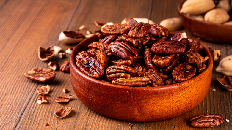 Shelled pecans in wooden bowl