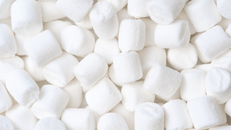 Pile of marshmallows on white background