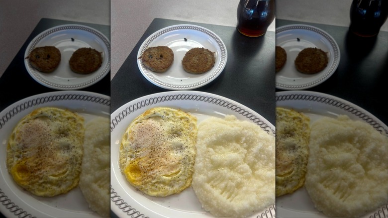 Eggs, grits, and sausage at Waffle House on white plates