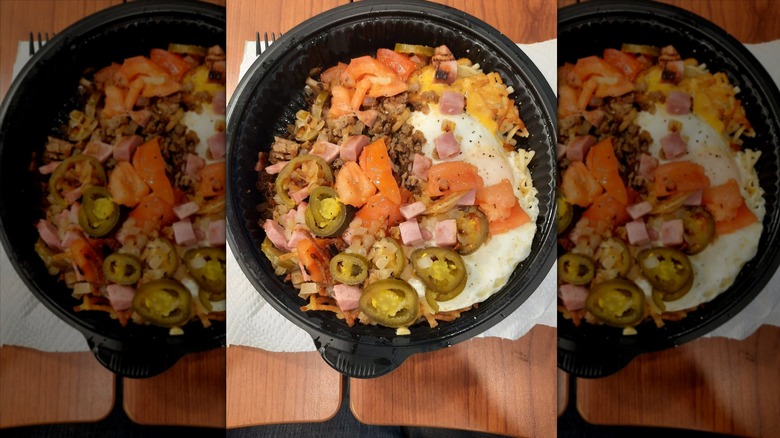 Waffle House hash browns with various toppings in to-go container