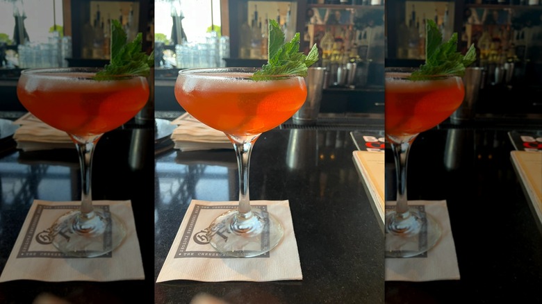 Strawberry cocktail in coupe glass on Cheesecake Factory napkin