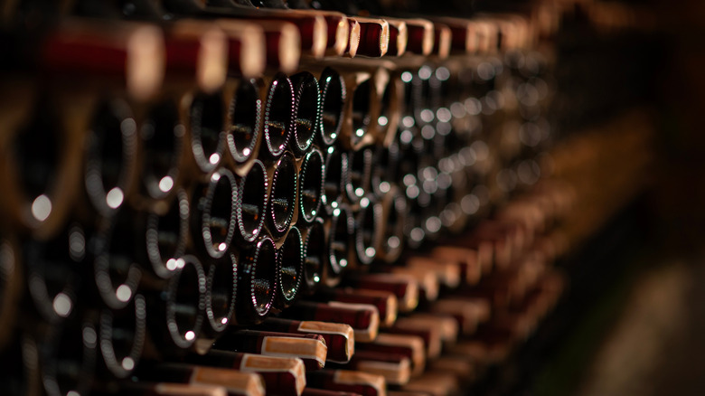 Rows of bottles in darkened wine shop