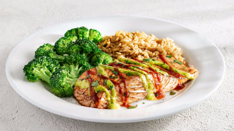 Chili's ancho salmon with vegetables on a white plate