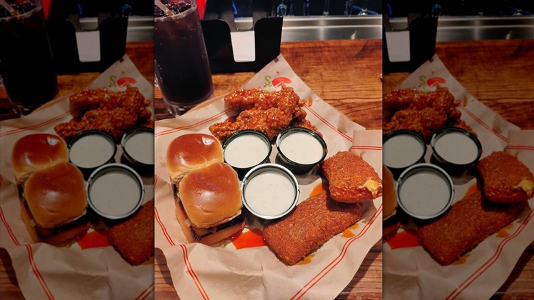 Chili's Triple Dipper on a basket with paper on a table