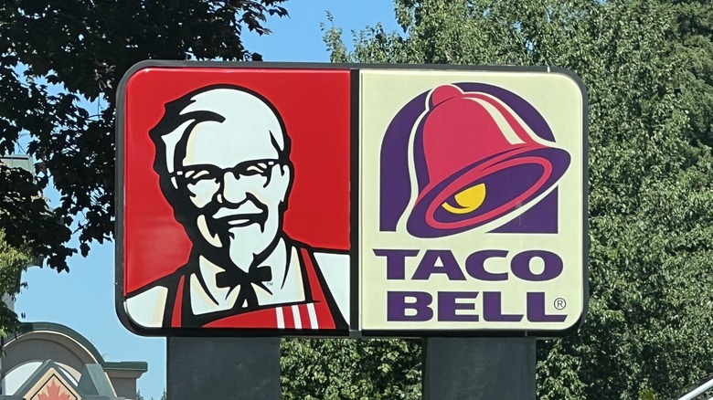 Joint KFC Taco Bell sign with trees in background