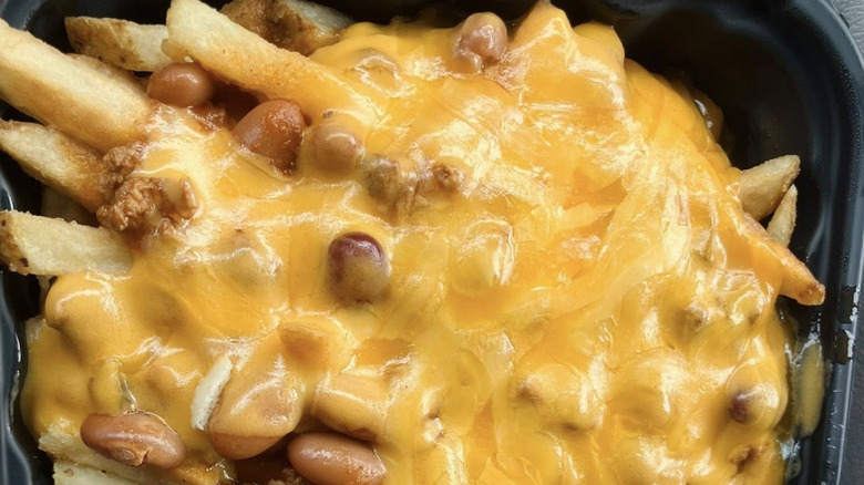 Wendy's cheese sauce in black plastic cup