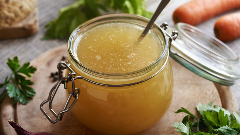 Broth in glass jar with spoon