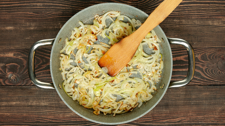 Sautéed garlic and onions in pan