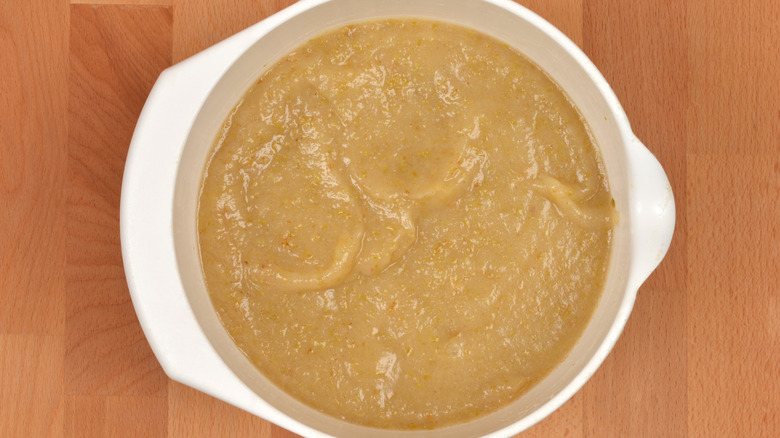 Mashed apples in large white bowl