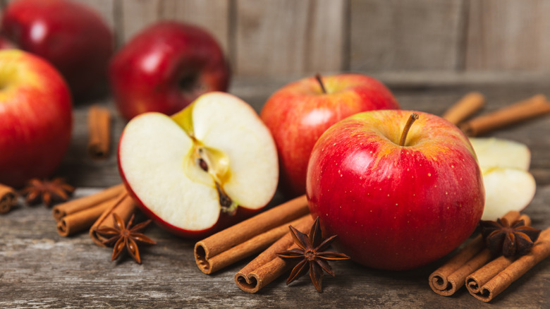 Cinnamon sticks with anise and red apples