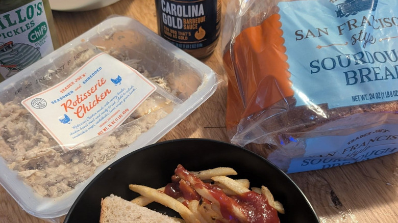 Trader Joe's Seasoned and Shredded Rotisserie Chicken next to loaf of bread