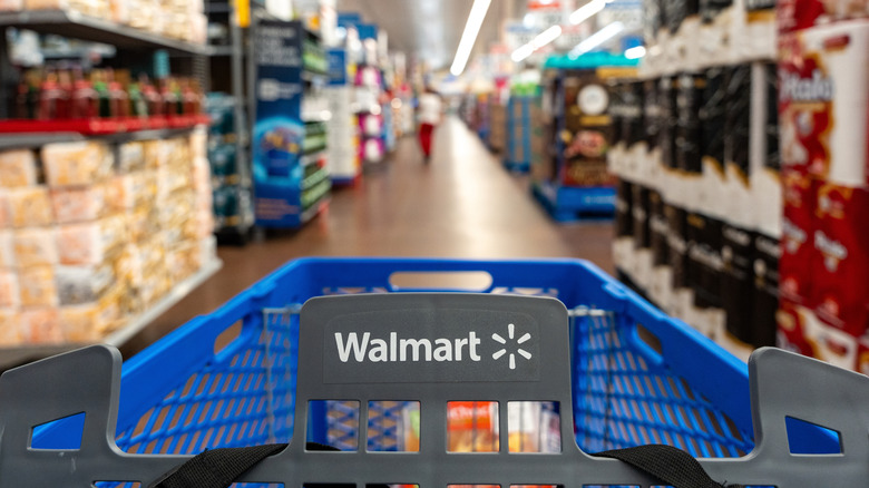 Walmart cart moving down the aisle