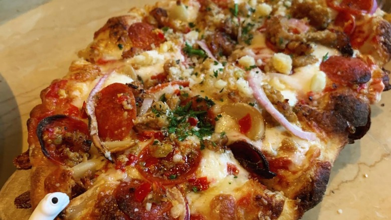 Bee Sting Flatbread Pizza on a wooden plank