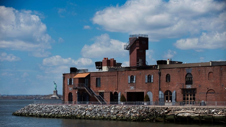 The production building of Red Hook Winery with the Statue of Liberty in the background