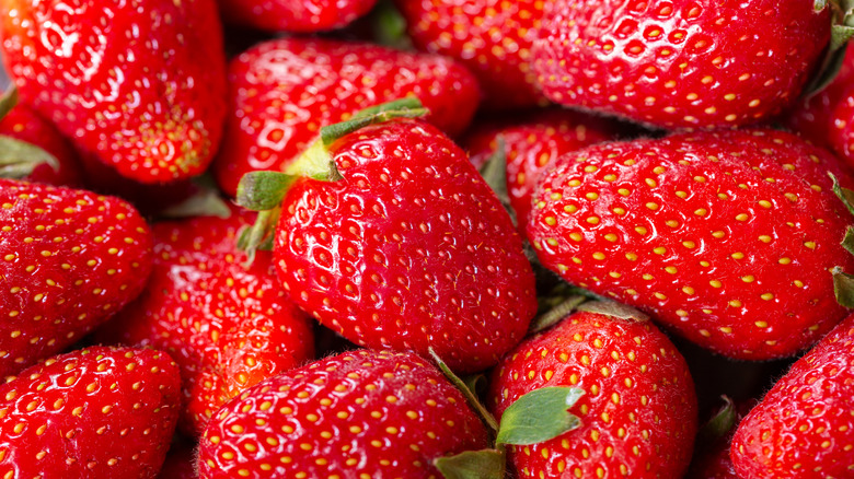 Close up of pile of fresh strawberries