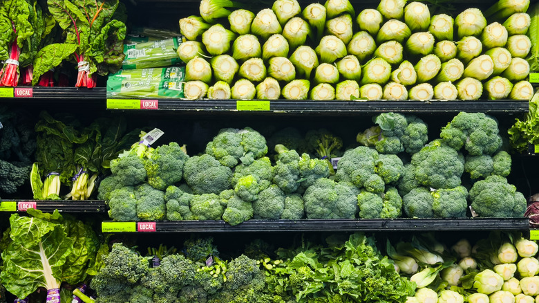 Broccoli, celery, cabbage and leafy greens are displayed at a grocery store