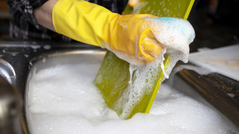 Washing cutting board with soap