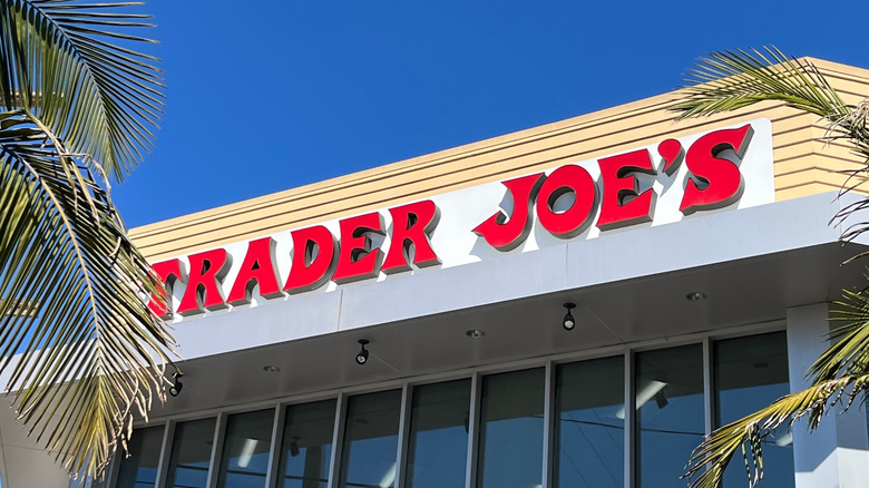 Trader Joe's sign with palm trees in front of building