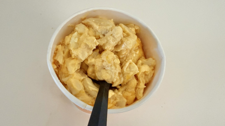 Homestyle Mac & Cheese with a black spoon