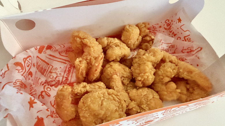 Container with breaded shrimp inside