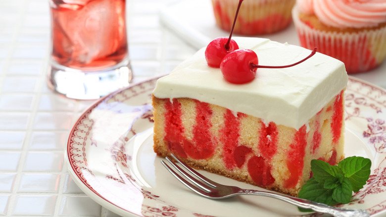 Cherry poke cake slice and cupcakes with an iced cherry drink