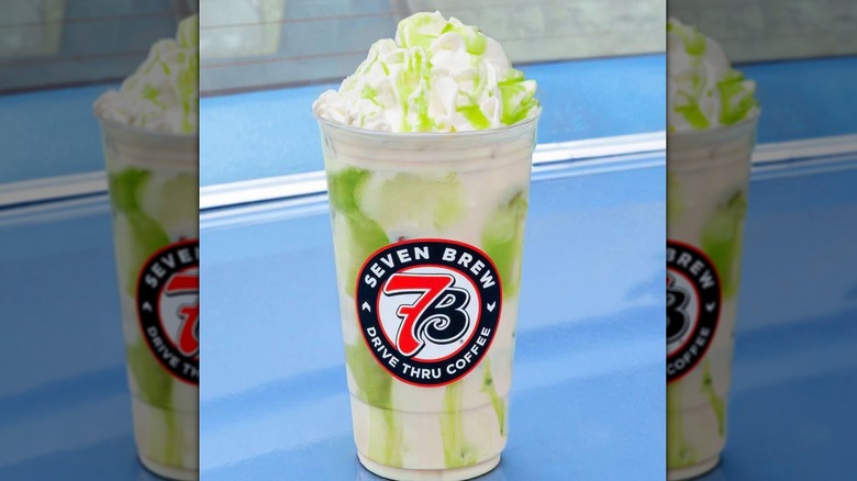 7 Brew Coffee Apple Butter Chai Latte sitting on blue surface