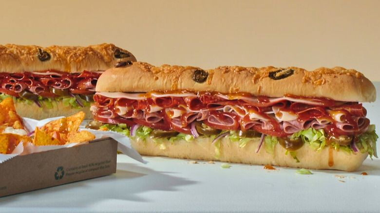 Subway Hot Honey sub sandwiches on gray surface against beige background