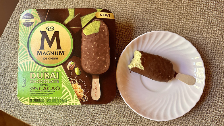box of Magnum Dubai Chocolate style ice cream with pink plate