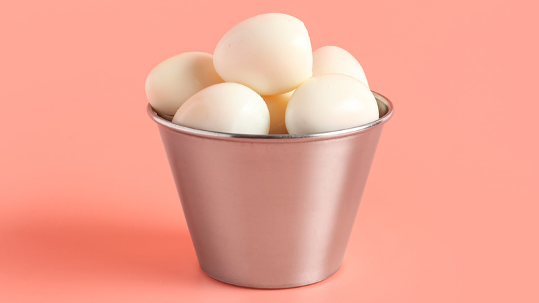 Metal pail filled with boiled eggs