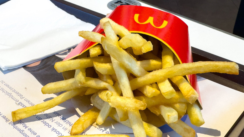 Close-up of McDonald's fries spilling out on to tray