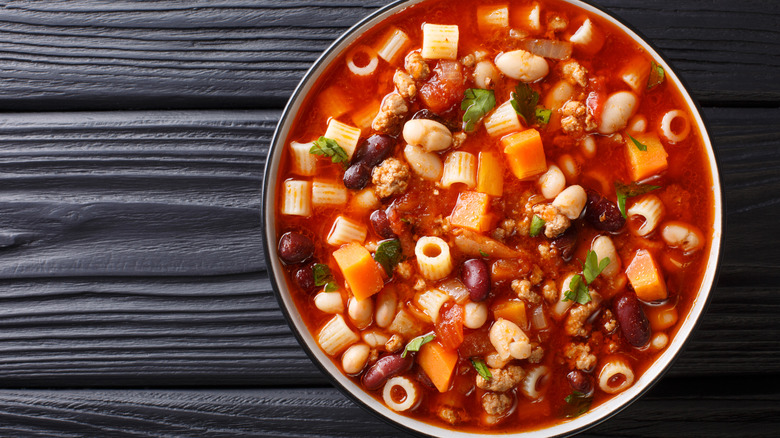 Minestrone soup on wooden surface