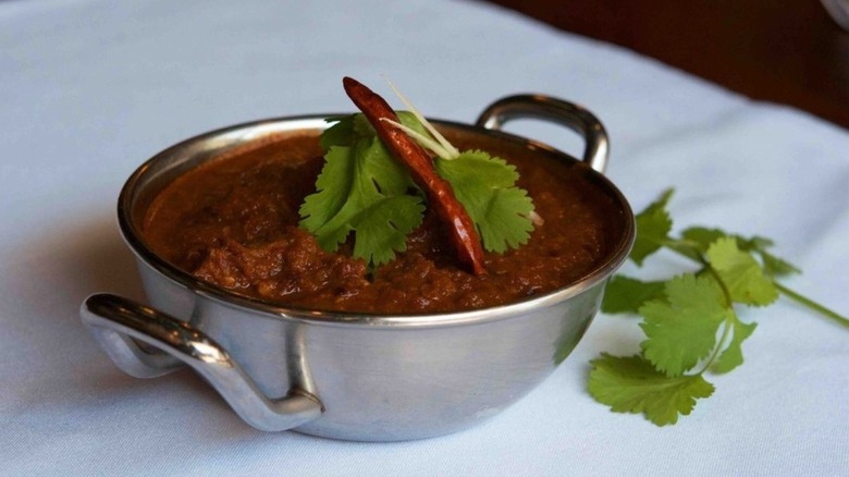 phaal curry in metal dish from Brick Lane