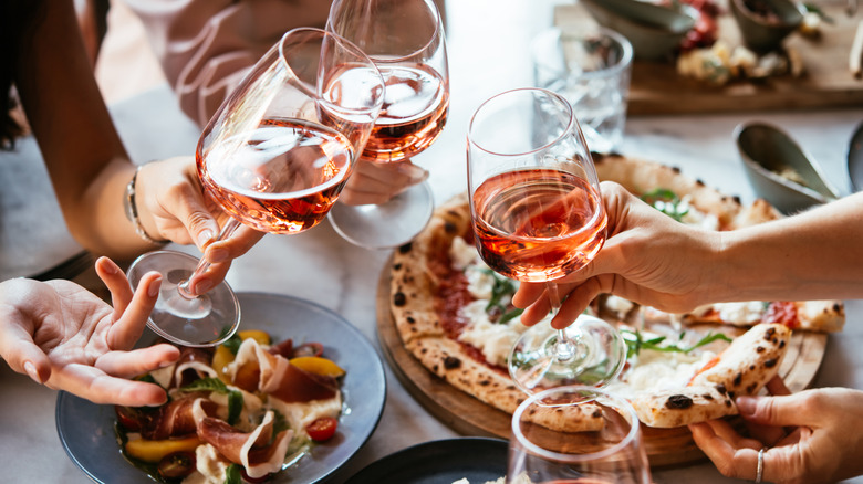 people eating Italian food and drinking wine at restaurant