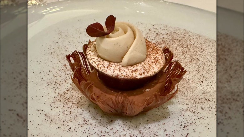 elaborate dessert on white plate at Le Cinq, mirrored image