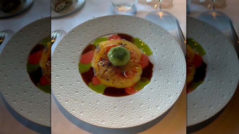 Bright fruit dish in bowl on table at Restaurant Guy Savoy, mirrored image
