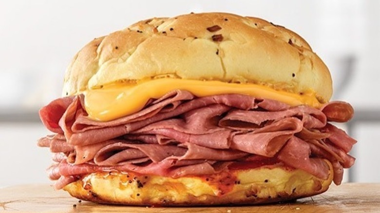 Arby's Beef 'N Cheddar sandwich with onion bun and cheese sauce