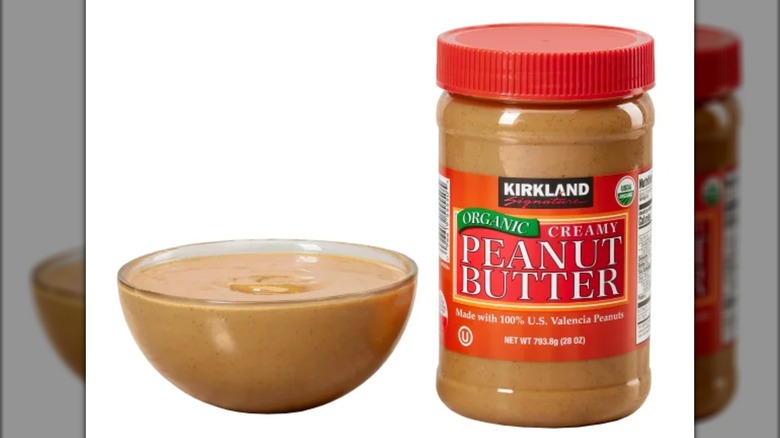 Kirkland organic peanut butter in jar and a clear bowl