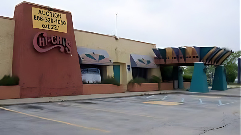 An abandoned Chi-Chi's restaurant sits empty, its building up for auction.