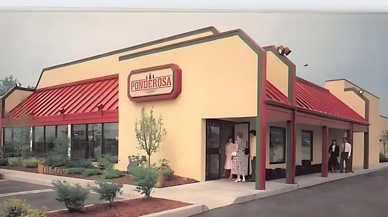 The facade of an old Ponderosa Steakhouse outlet, with patrons walking into the establishment