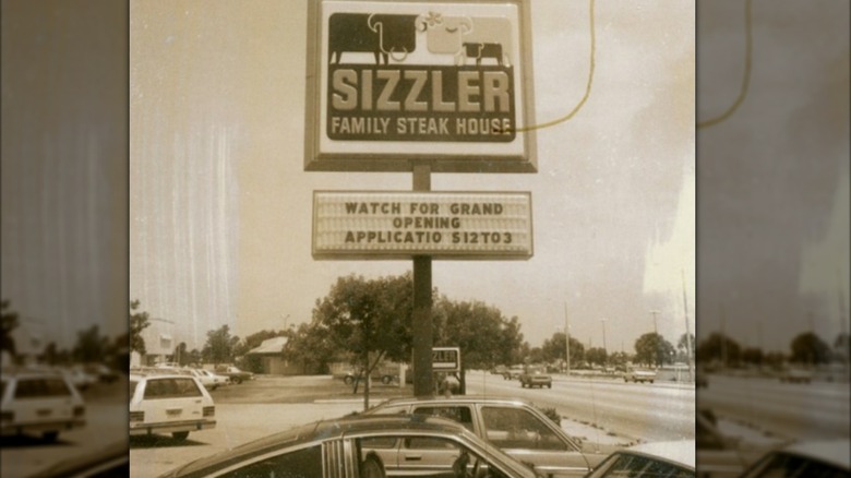 A sign for Sizzler Family Steak House at 801 E. Commercial Blvd in Oakland Park, Florida
